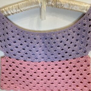 pink and purple crochet crop top on hanger