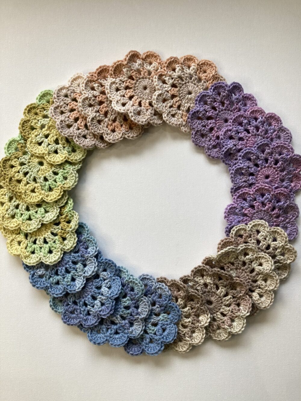 ring of cotton crochet coasters different colours