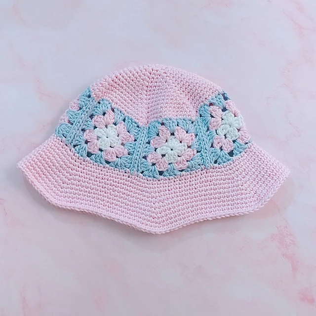 pale pink crochet bucket hat with blue granny squares