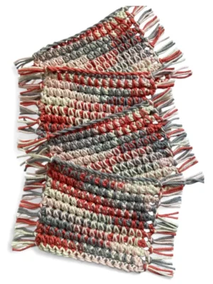 red grey and white fringed crochet mug rugs