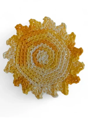 set of 4 sun coasters in yellow variegated yarn