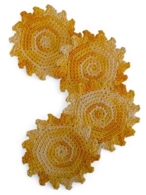 set of 4 sun coasters in yellow variegated yarn