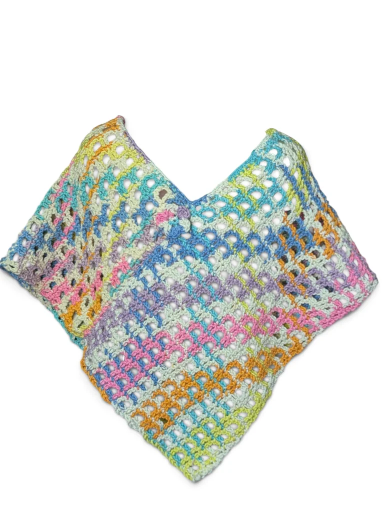 crochet rainbow poncho in checkerboard lace pattern