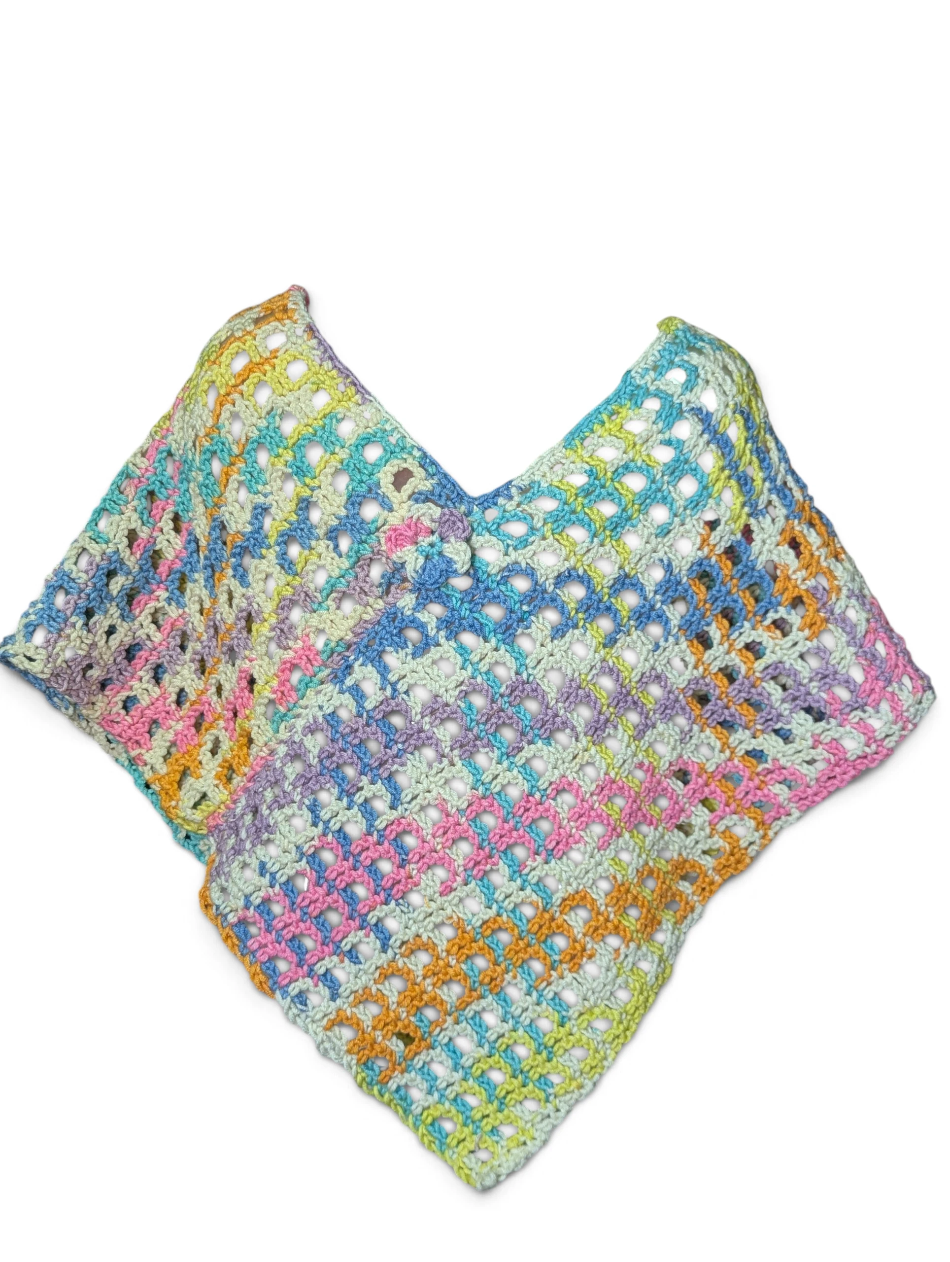 crochet rainbow poncho in checkerboard lace pattern