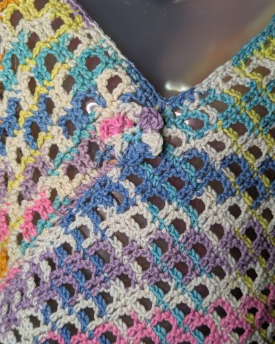 crochet rainbow poncho in checkerboard lace pattern